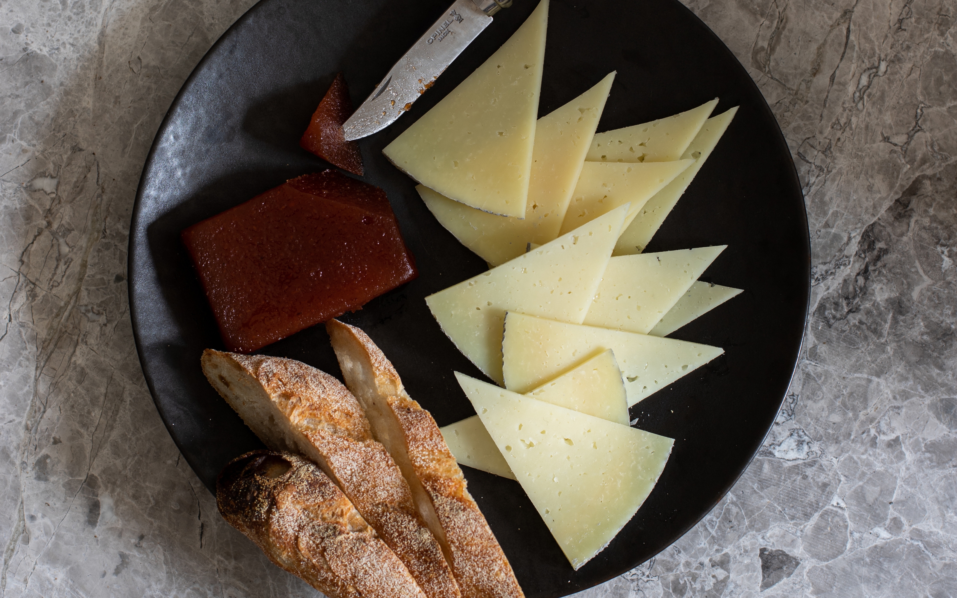 Manchego El Esparto Will Studd On Plate Sliced